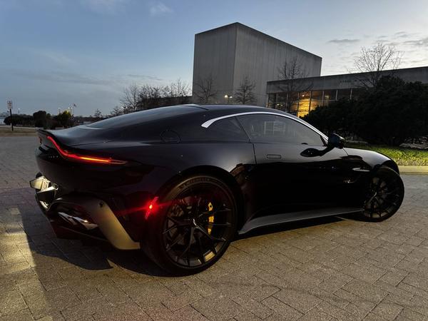 Rear three-quarter, tail lights on